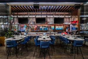 Kona Grill Riverton interior shot with dining tables, chairs and bar